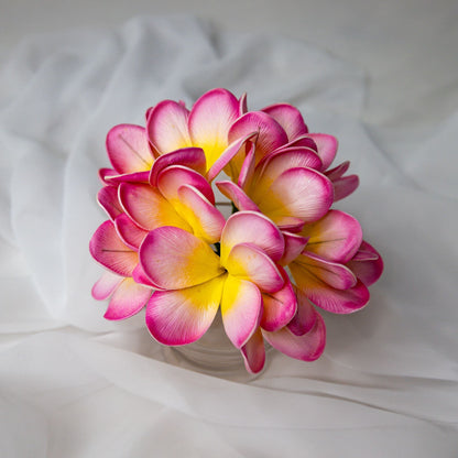 artificial Light Pink Frangipani Flowerhead in glass clear vase top view