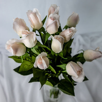 artificial Light Pink Real Touch Rose Buds in clear glass vase top view