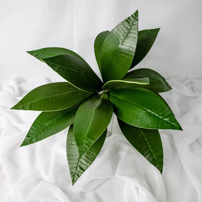 artificial Pointed Frangipani Leaves in clear glass vase top view