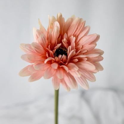 Artificial pale pink gerbera