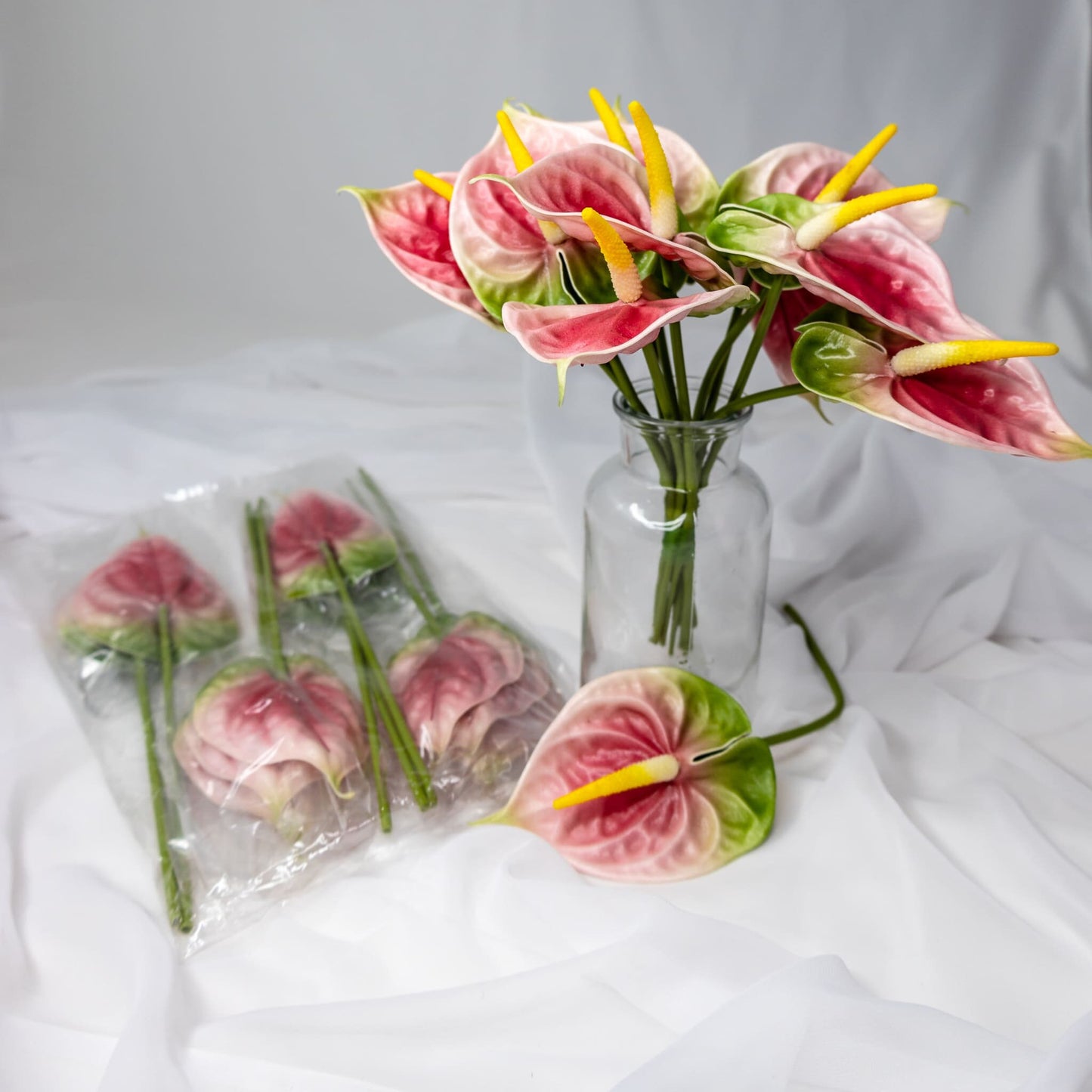 artificial Pink/Green Small Anthuriums in clear glass vase