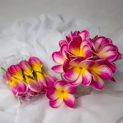 artificial pink frangipani orchids place in glass vase