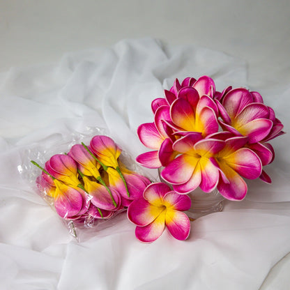 artificial pink frangipani orchids place in glass vase